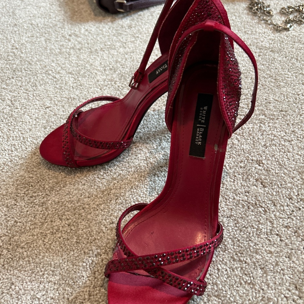 Read White House black market, high heels with red gemstones